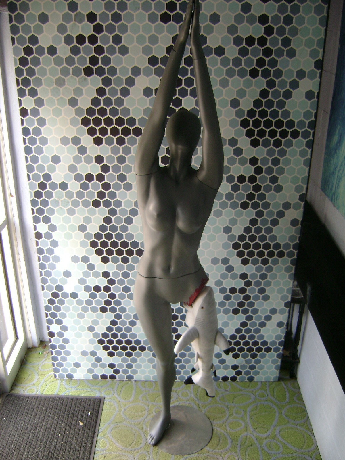 GRAY MANNEQUIN FEMALE POSED W/ BEACH SHARK LEG