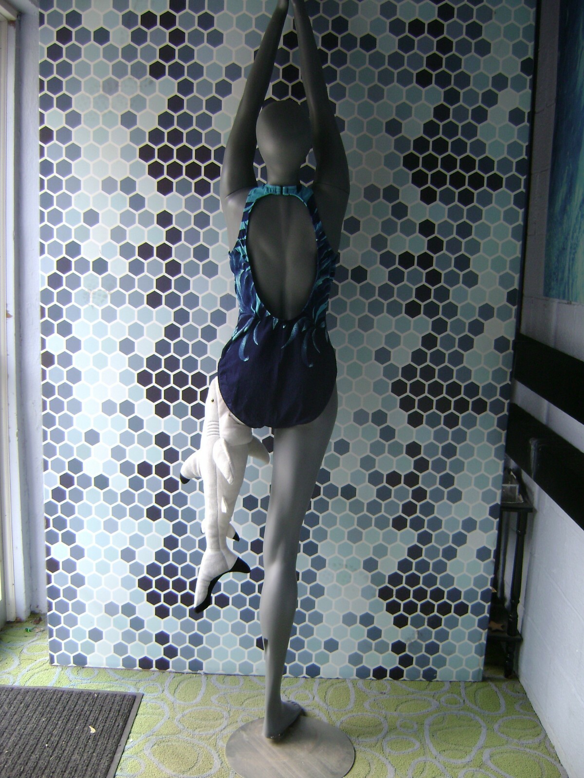 GRAY MANNEQUIN FEMALE POSED W/ BEACH SHARK LEG