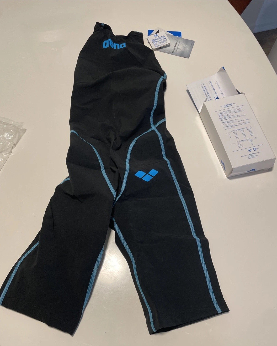 New. Tags/Box. Never Worn. Arena Women’s Openback Kneeskin Black/Blue Size L(11)