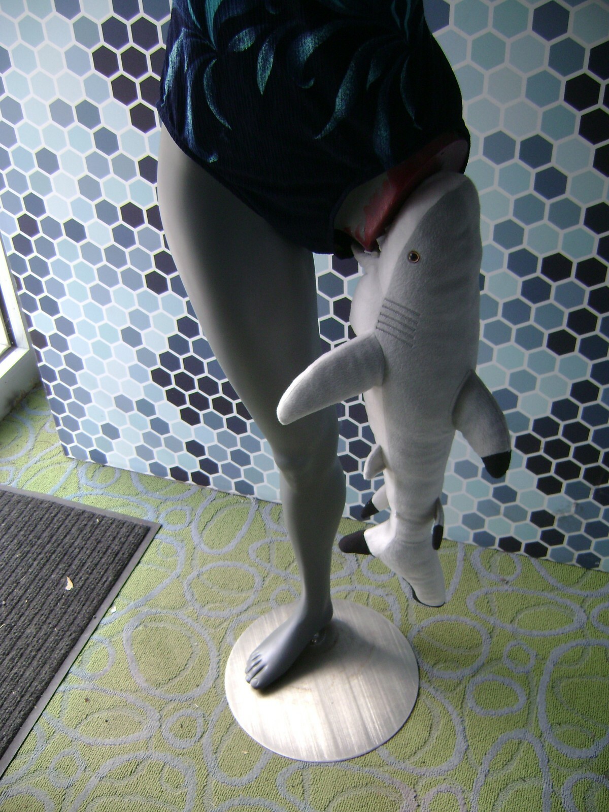 GRAY MANNEQUIN FEMALE POSED W/ BEACH SHARK LEG