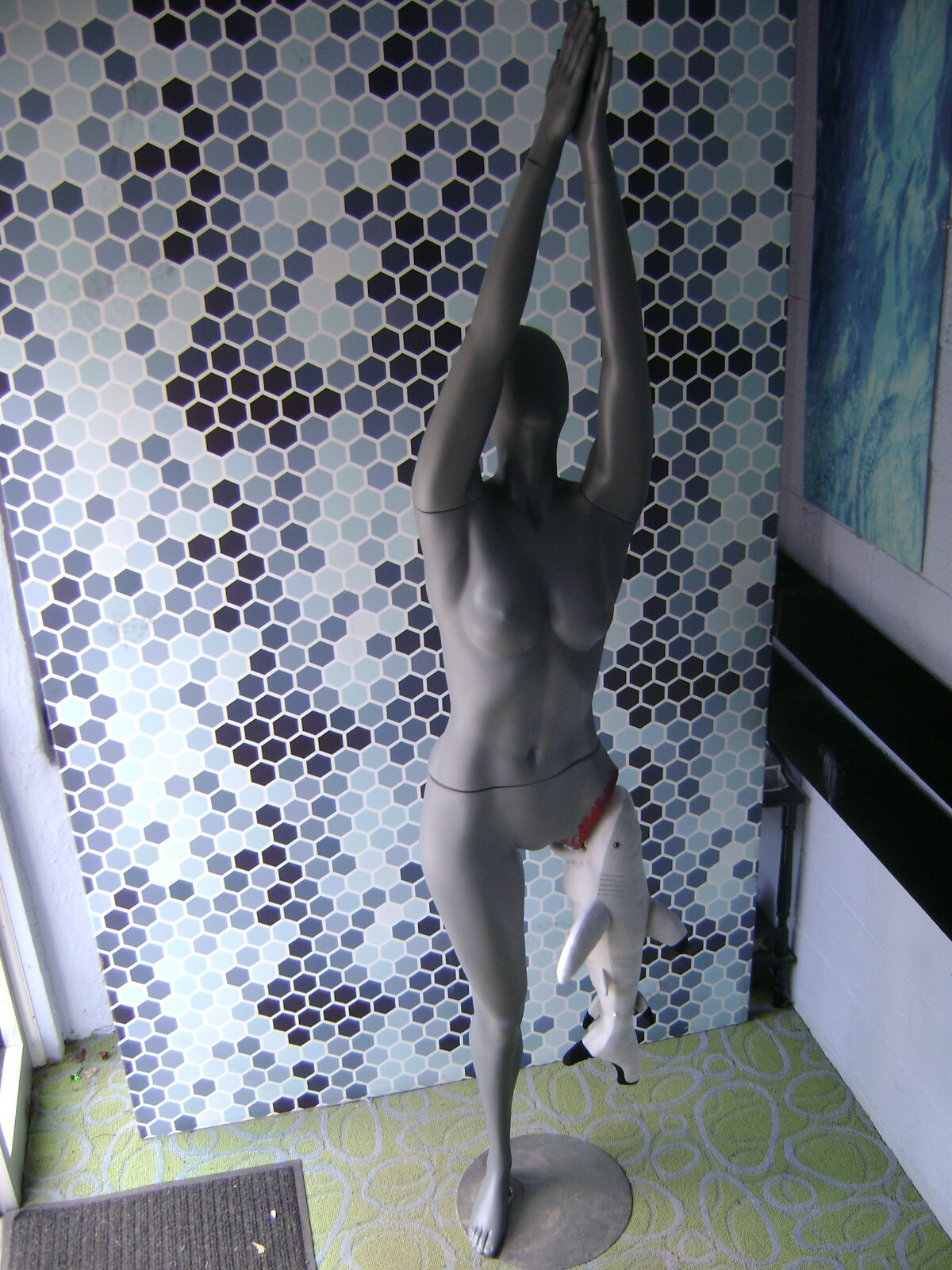 GRAY MANNEQUIN FEMALE POSED W/ BEACH SHARK LEG